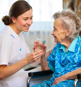 VNAA nurse assisting elderly woman